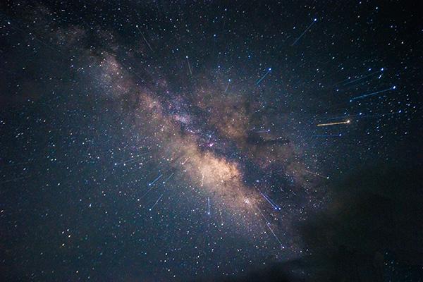 The Milky Way with meteor streaks in the foreground