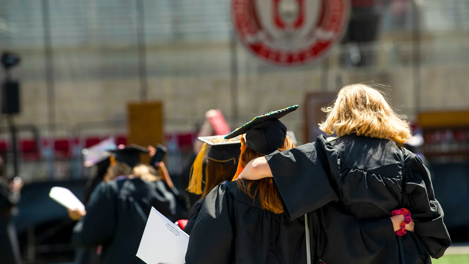 Graduates walking after getting their diplomas