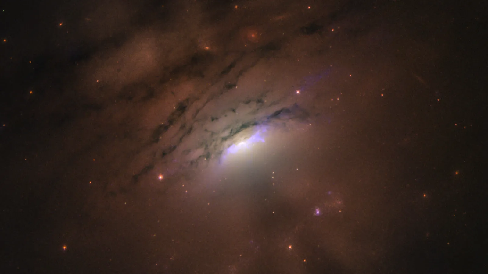 Image of a black hole behind rings of dust in galaxy IC 5063