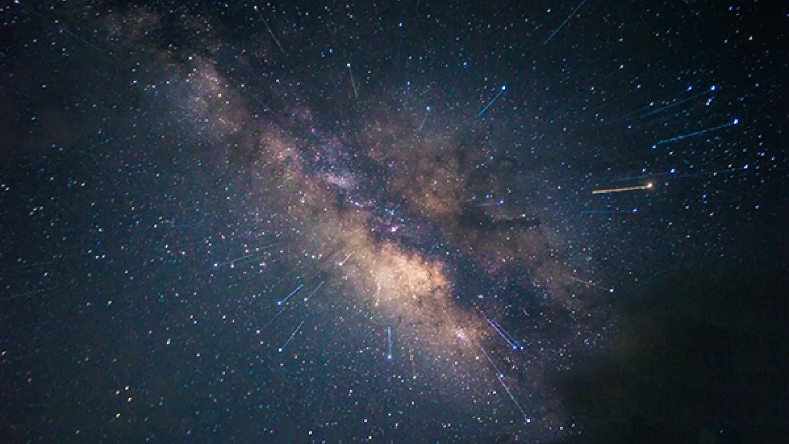 The Milky Way with meteor streaks in the foreground