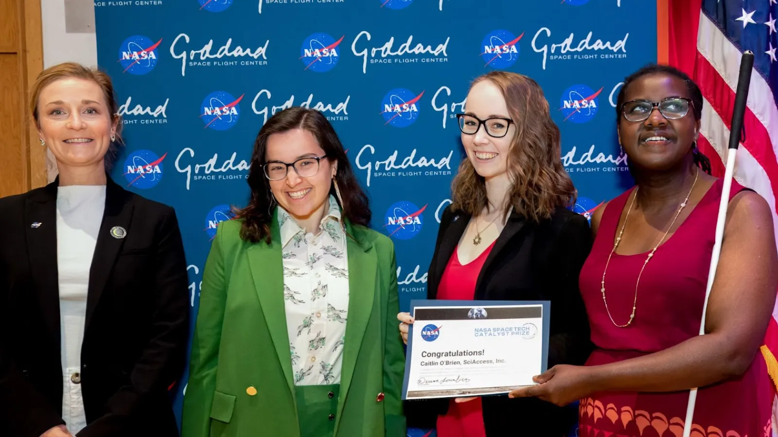 Caitlin O'Brien with 3 women receiving award