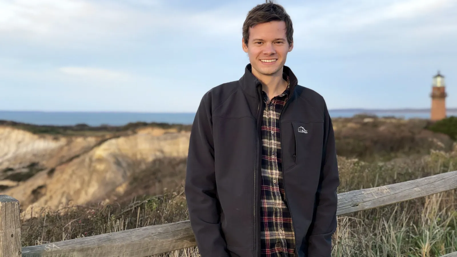 Grant Tremblay wearing a black jacket and flannel shirt