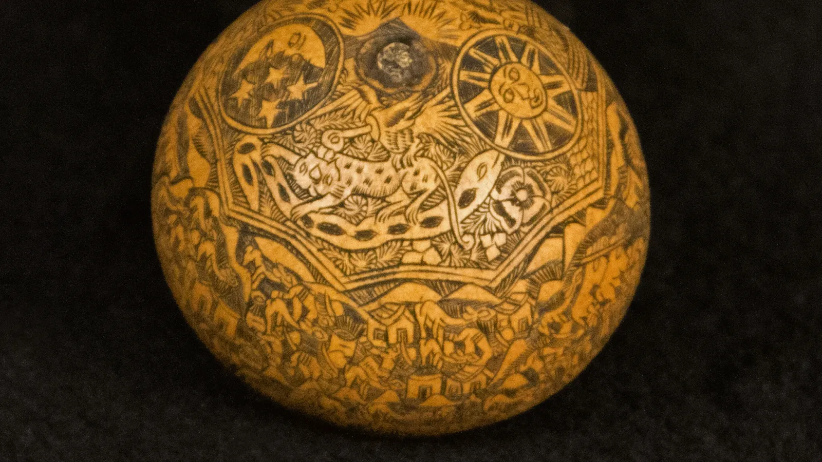 Wooden sphere with Andean/Amazonian carvings