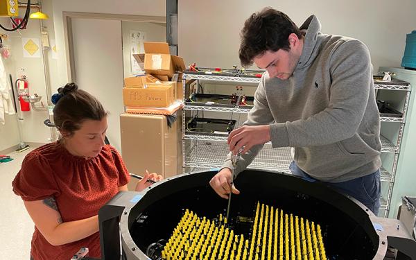 Julia Brady and Jacob McCloskey working on the SDSS-V FPS unit for APO