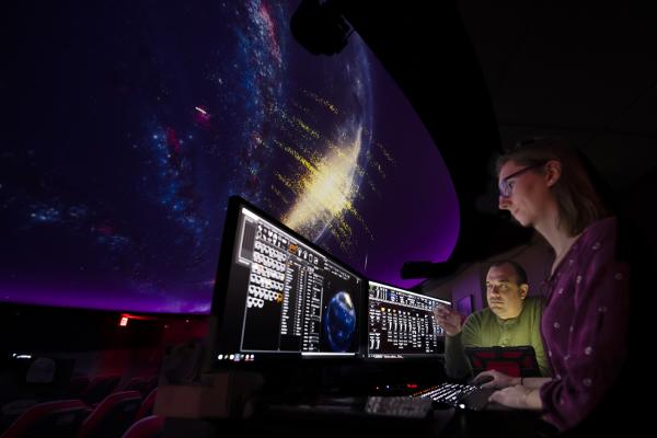 Picture of Wayne Schlingman and Emily Griffith in the OSU planetarium