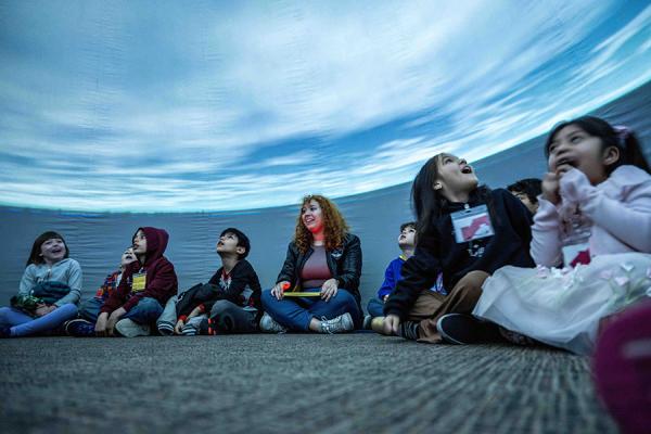 kids in planetarium dome - solstice outreach