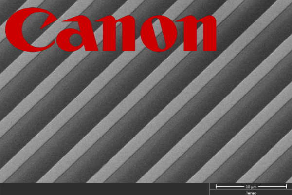 Precision fabricated grating overlaid with Canon logo
