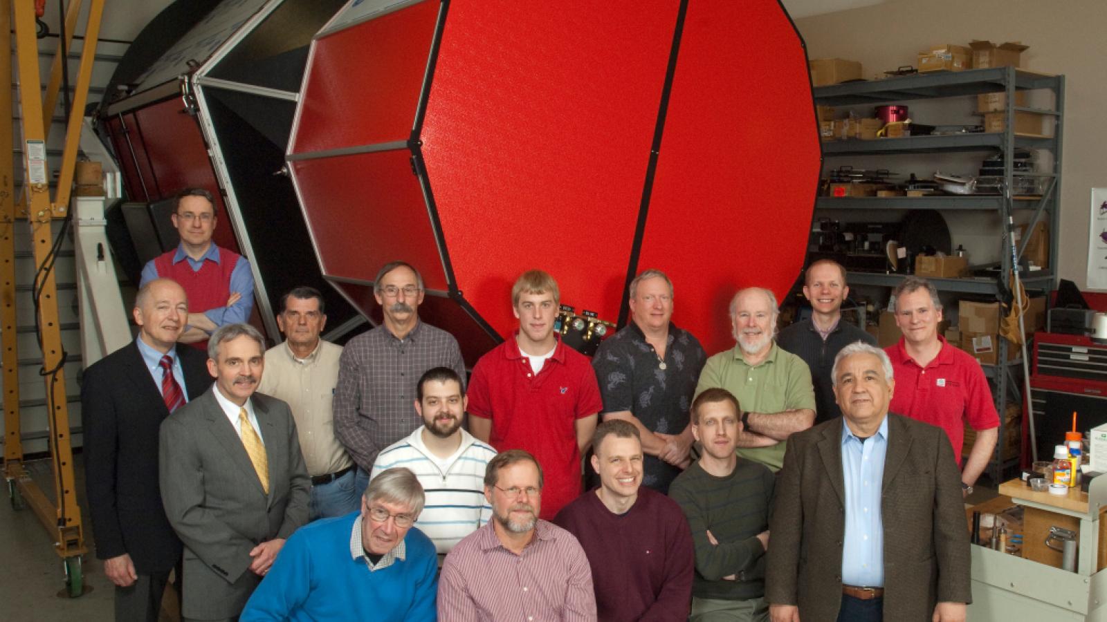 The MODS instrument at OSU with the team who worked on its development